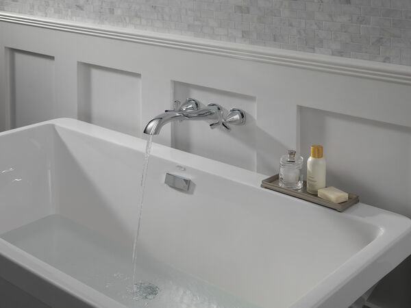 Delta Stryke in Chrome installed on a wall above a bathtub